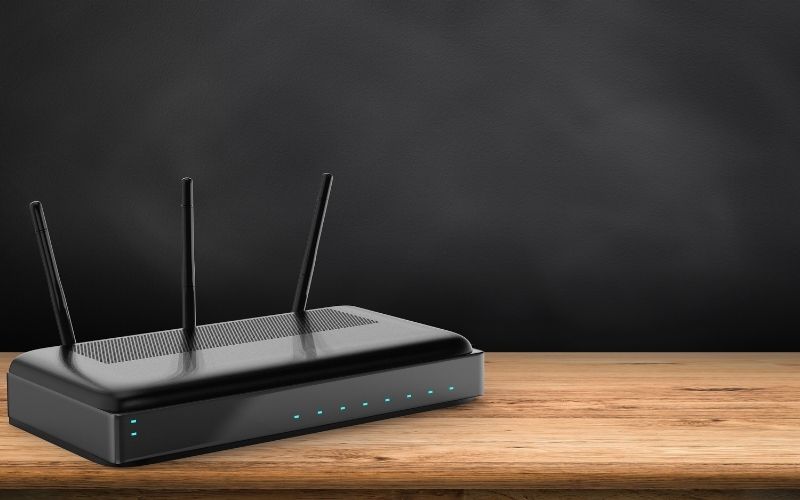 Black router on a wooden table